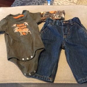 6 M carhartt jeans (NWT) and camo onesie